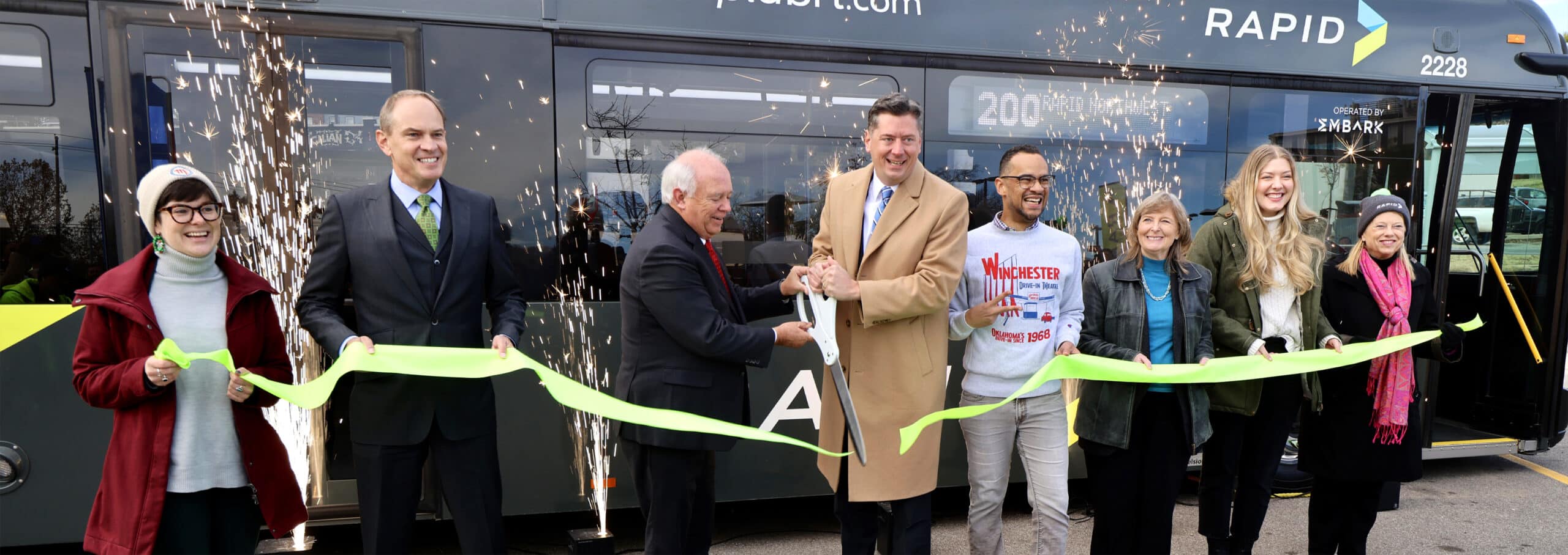 The official ribbon cutting at the EMBARK RAPID bus line launch event.
