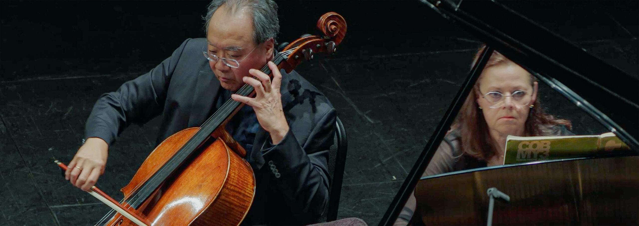 An Oklahoma cellist playing a concert.