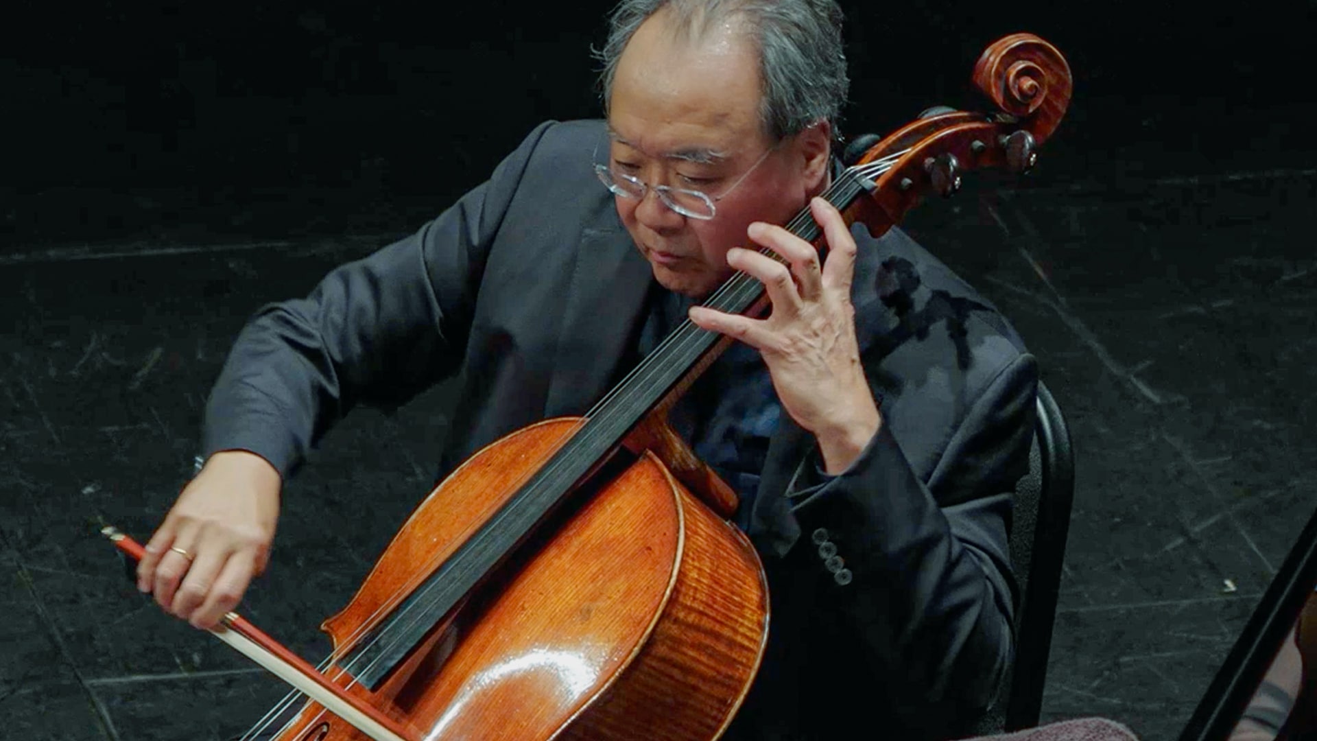 An Oklahoma cellist playing a concert.