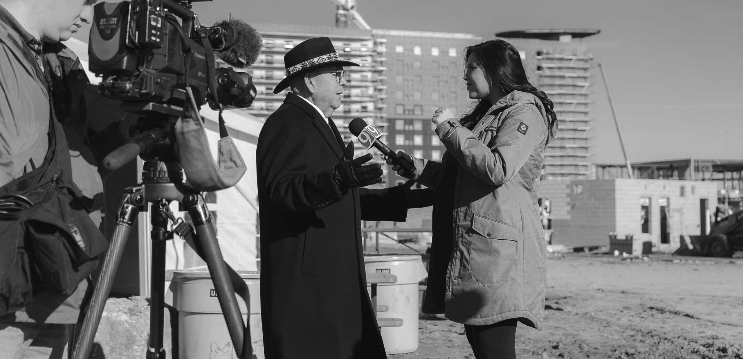 Chickasaw Nation Governor Anoatubby is interviewed by a reporter at the groundbreaking event for the OKANA Indoor Waterpark & Resort.