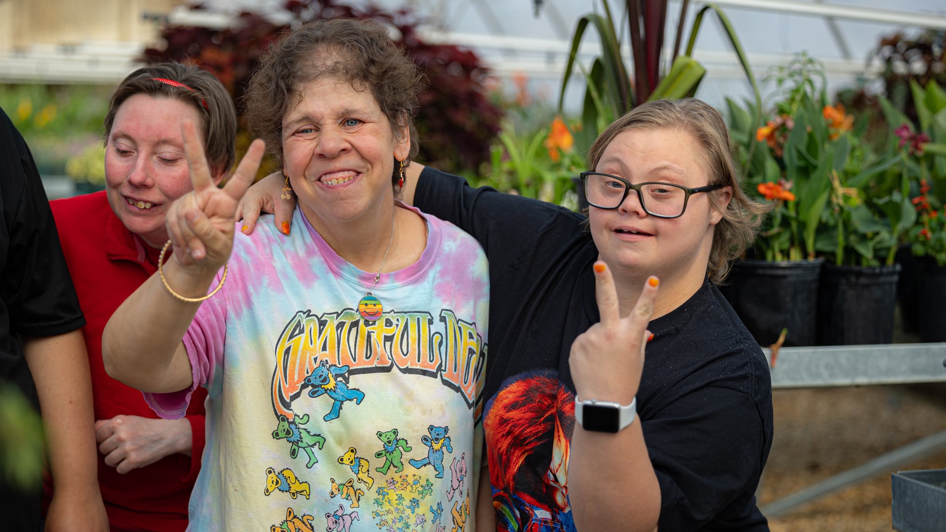 CARC residents having fun in the greenhouse.