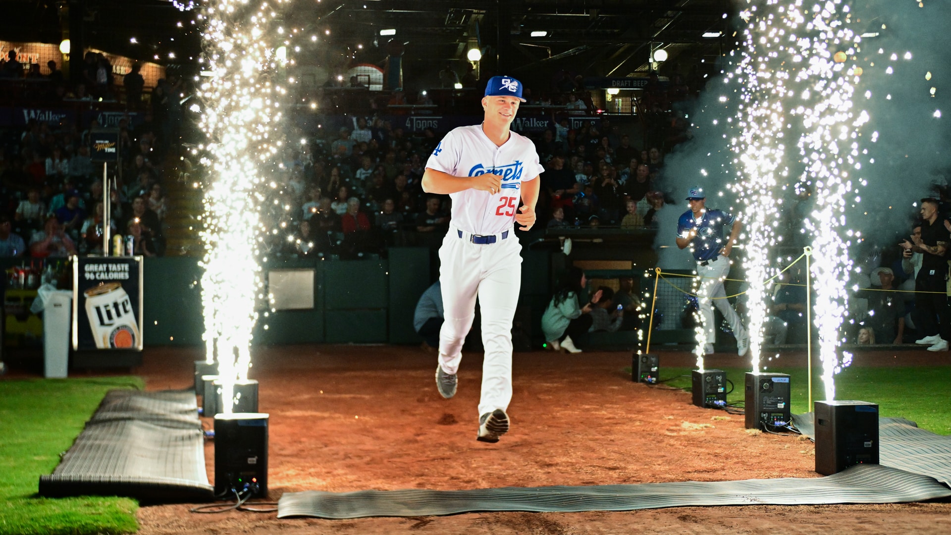 An OKC Comets baseball player running onto the field during the name change launch event.