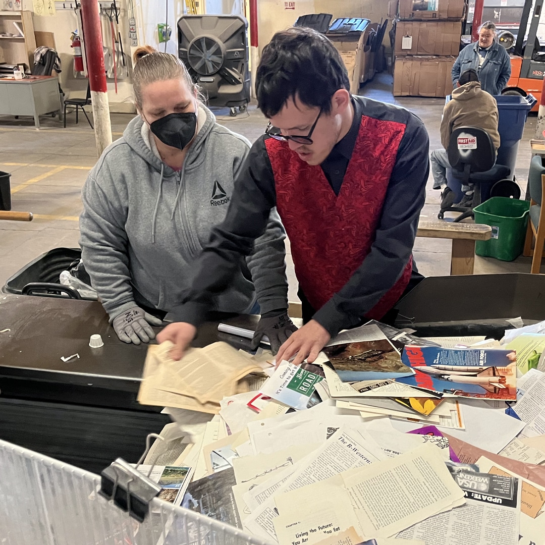 CARC residents shredding documents.