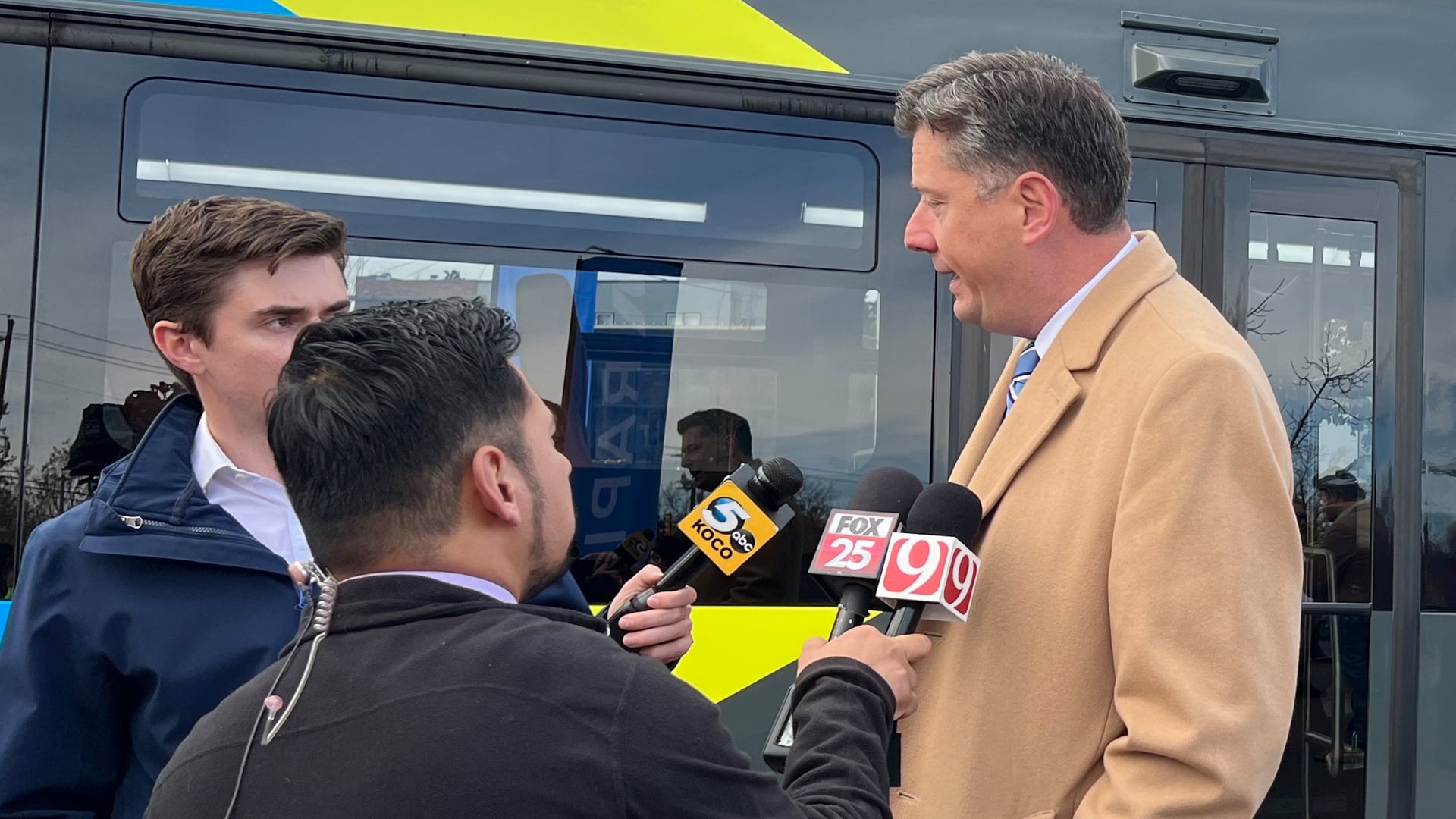 News interview happening at the EMBARK RAPID bus line launch.
