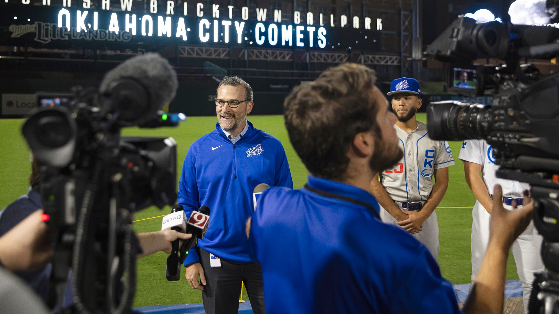 The OKC Comets team staff being interviewed for a news story.