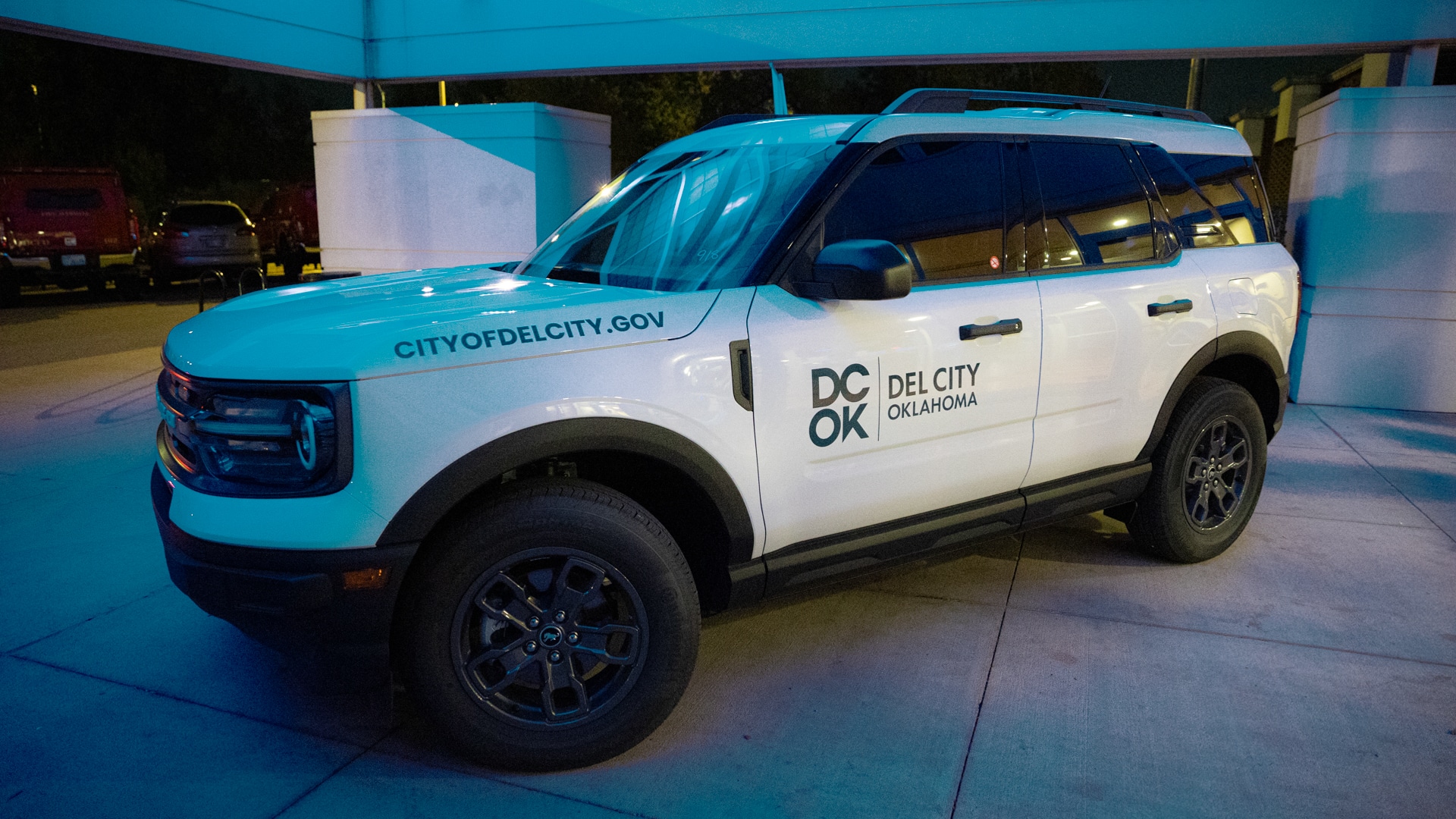 A compact car wrapped in the new Del City branding.
