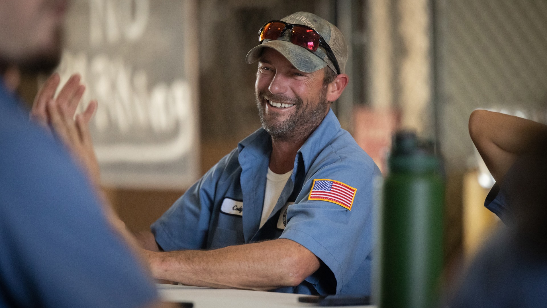 A Del City staff member smiles.