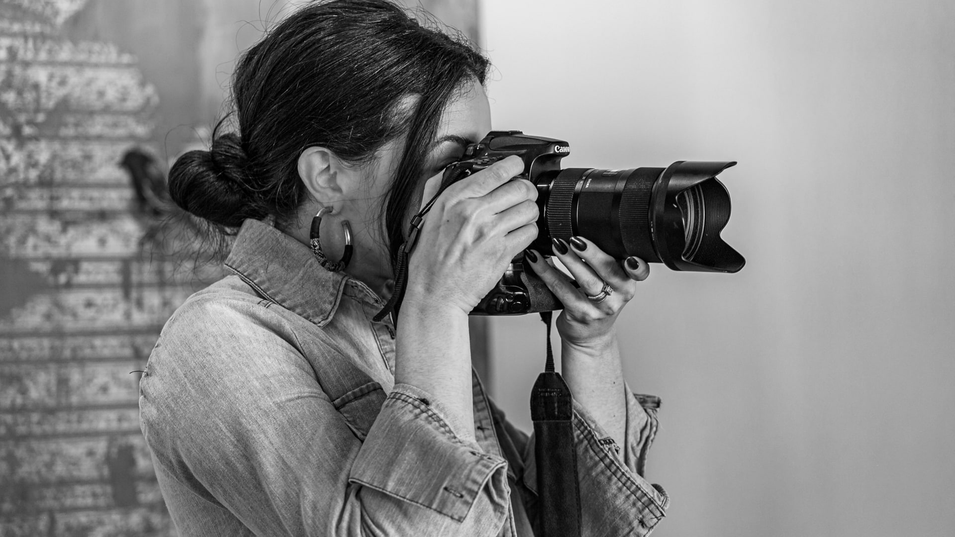 A Koch Comm photographer taking photos around the office.